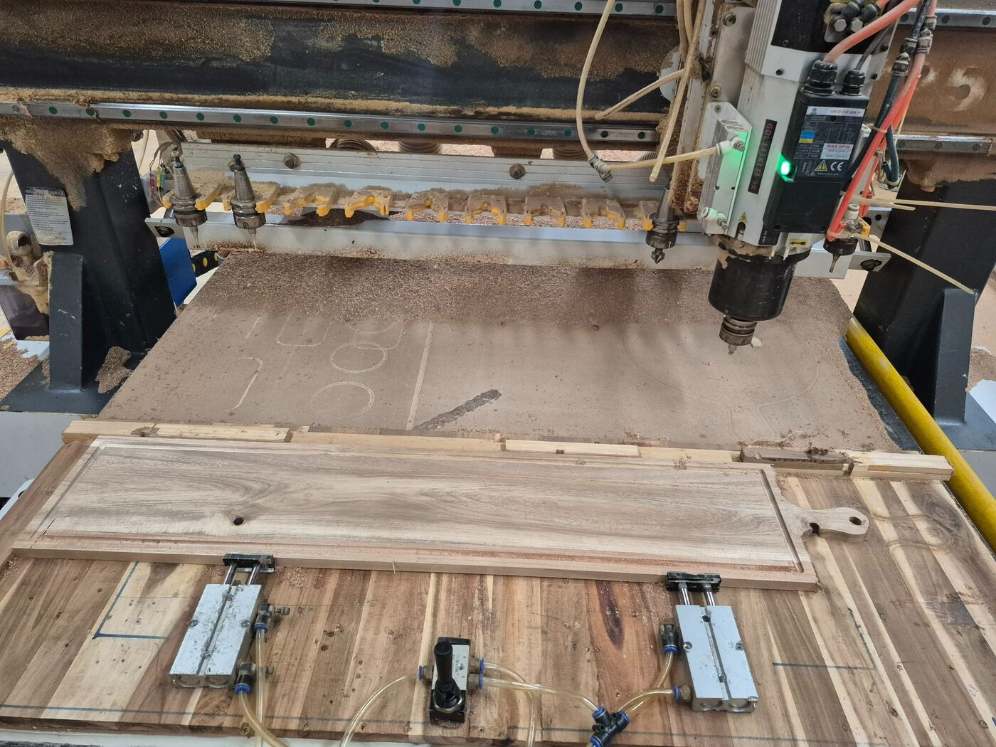 CNC routing a custom wooden board profile during private-label production